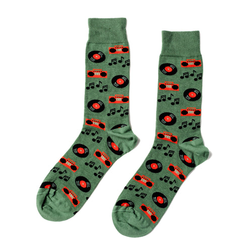Sage green crew socks featuring illustrated vinyl records orange boomboxes and music notes by Yellow Owl Workshop