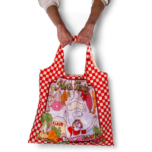 Person holding illustrated pizza tote bag with red gingham border and Hot and Tasty pizza parlor print by Yellow Owl Workshop