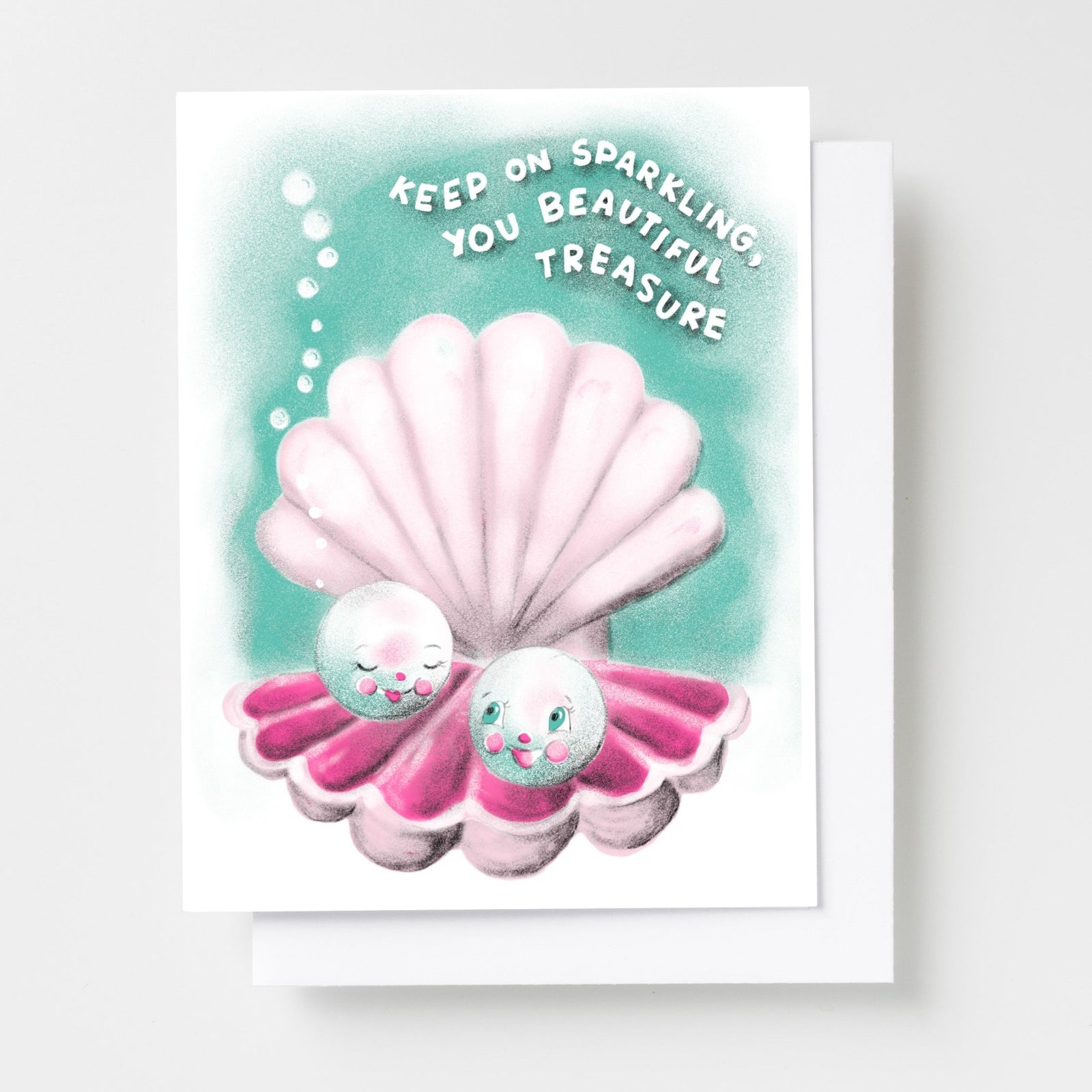 Risograph greeting card with two illustrated pearl characters nestled in a pink scallop shell on a teal background with bubbles, text reads Keep On Sparkling You Beautiful Treasure in white lettering